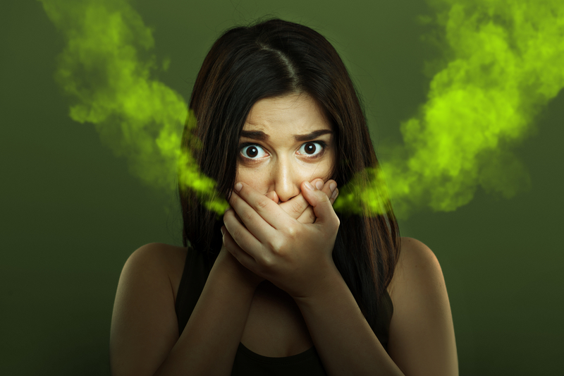 Woman with halitosis