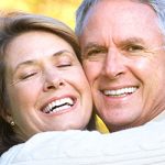couple with beautiful smiles due to cosmetic dentistry